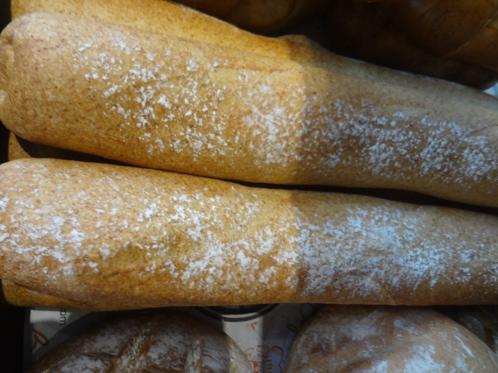 Flour-dusted seeded rye loaves